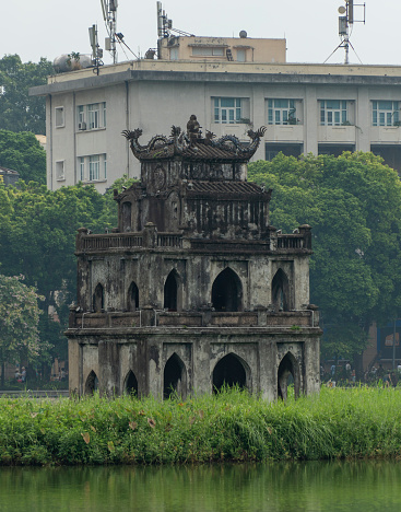 Turtle Tower in the middle of Hoan Kiem Lake, a famous tourist destination and symbol of Hanoi capital