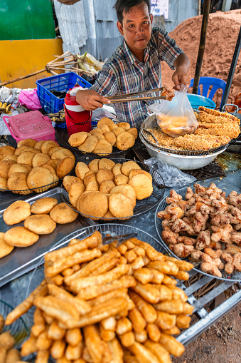Cambodian man selling snacks in Siem Reap, Cambodia
