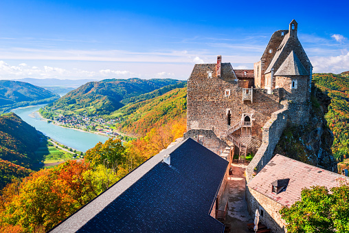 Beautiful colourful Rhine valley landscape in Germany at autumn time. Town of Bacharach and Stahleck Castle in the foreground. Rhineland Palatinate in Germany.