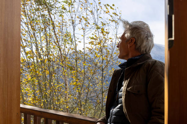 istock Mature man relaxes on balcony in mountains 1822404678