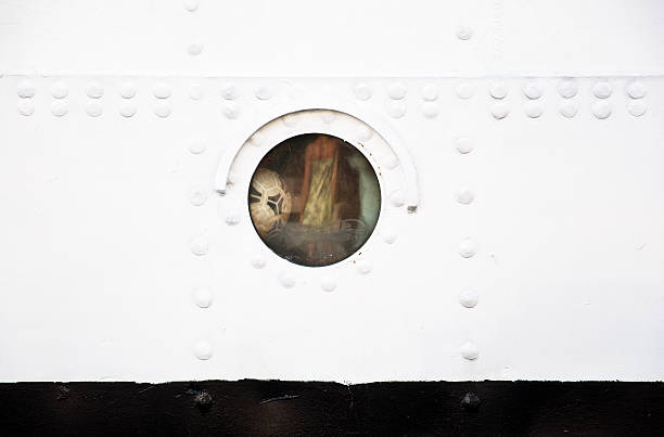 Ball in ship's porthole.