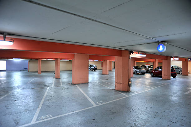 istock Brightly lit underground multi-storey car park 182241181