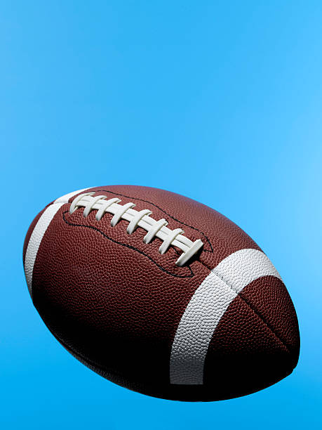 istock football flying in the sky 182241574