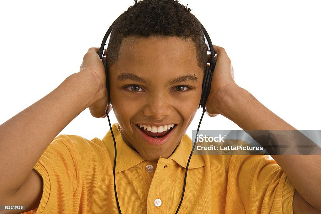 若い 10 代の少年と笑顔を着て、ヘッドフォン - ヘッドフォンのロイヤリティフリーストックフォト