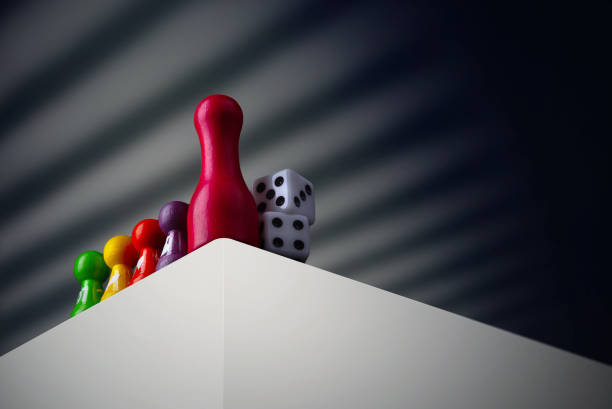 Board game concept -Time to play a game. Many different figures and dices. Dark background free space for text