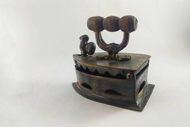 istock Miniature Antique charcoal iron on white background 1822423061