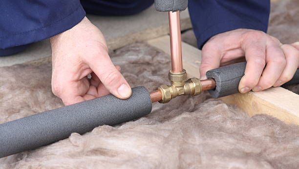 istock Plumber joining copper water pipes. 182243007