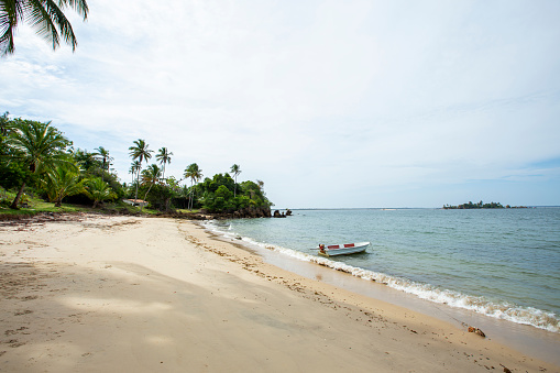 Single small boat on an empty beach at a brazilian northeastern island