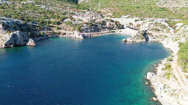 Drone shot of Tatinja Beach in the seaside municipality of Karlobag on the Adriatic coast in Croatia