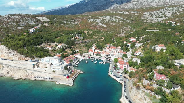 Ascending high drone footage of Jablanac village on the Adriatic Sea in Lika-Senj County, Croatia