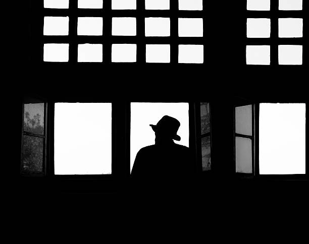 istock Man looking out of window 182243137