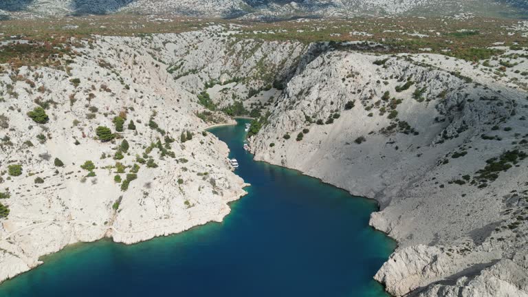 Ascending high drone footage of Zavratnica inlet in Jablanac, Croatia