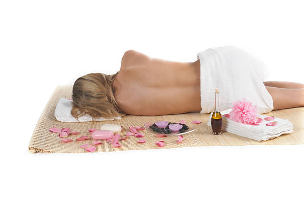 Beauty spa concept "Isolated wellness concept, beautiful woman in spa treatment with orchid flower heads and bamboo ..." jacraa2007 stock pictures, royalty-free photos & images