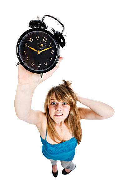 istock Female holding a clock | I'm late! 182243571