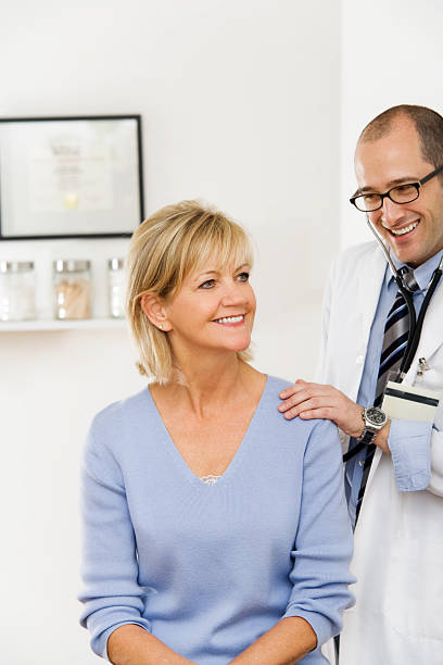 Doctor with Patient in Medical Office stock photo