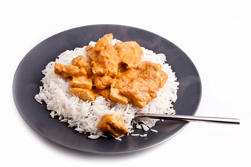 Delicious plate of rice and chicken with Korma Sauce