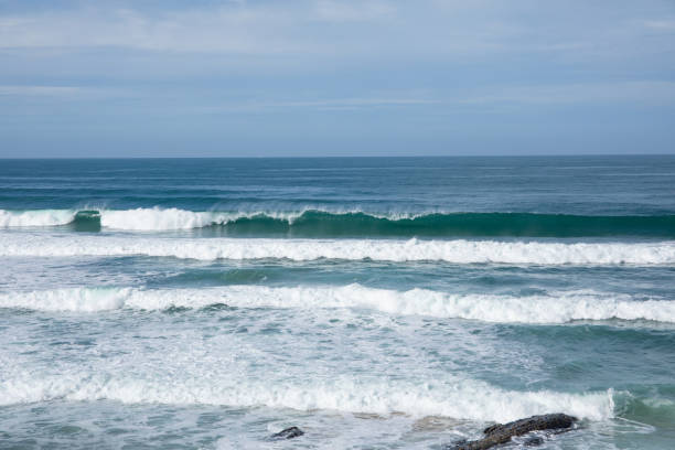 istock Scenic view of surf pounding empty beach 1822440149