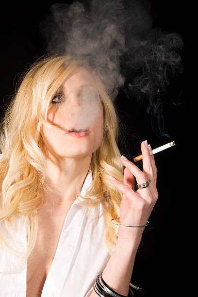 istock Young blonde woman smoking 182244113