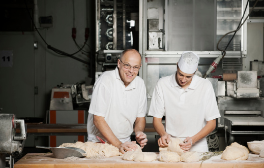 Baker and his son kneading dough.More photos of the baker and the bakery: