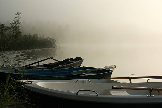 istock boats at misty morning 182245169