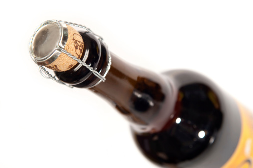 A corked beer bottle isolated on white with a shallow depth of fieldFind Similar Images in my Lightboxes