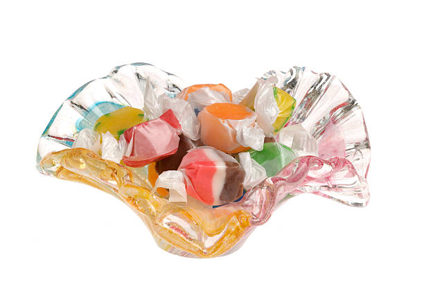 Colorful assortment of Salt Water Taffy on dish white background