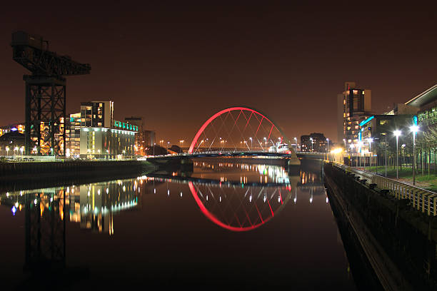 Stillness and Reflections on the River Clyde, Glasgow. "Glasgow's Clyde Arc at Night.The River Clyde was perfectly still, creating stunning reflections of the Squinty Bridge." govan stock pictures, royalty-free photos & images