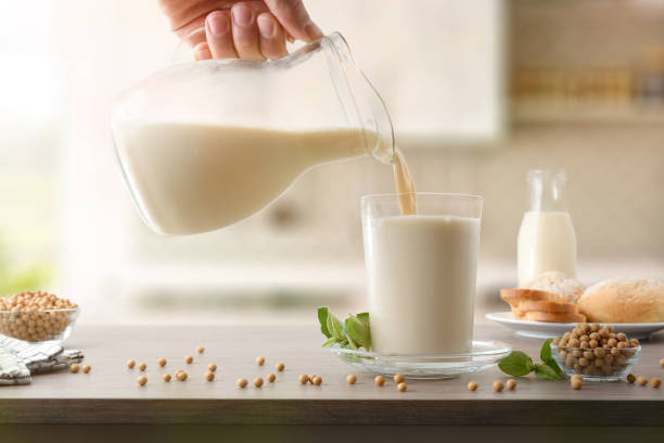 istock Filling glass with soy milk from a jug in kitchen 1822464809