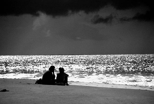 couple sitting on the beach