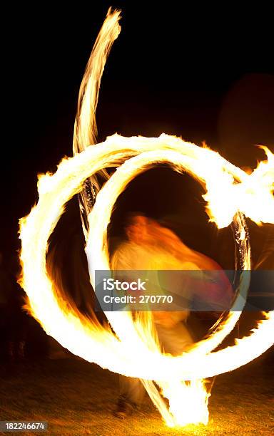 Dynamic Fire Dancer At Night Stock Photo - Download Image Now - Flame, Flaming Torch, Activity