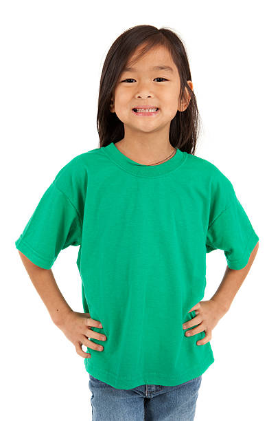 An Asian girl wearing a green t-shirt Asian girl wearing a t-shirt. Please view these along with other t-shirt images in my portfolio. 6 7 years stock pictures, royalty-free photos & images