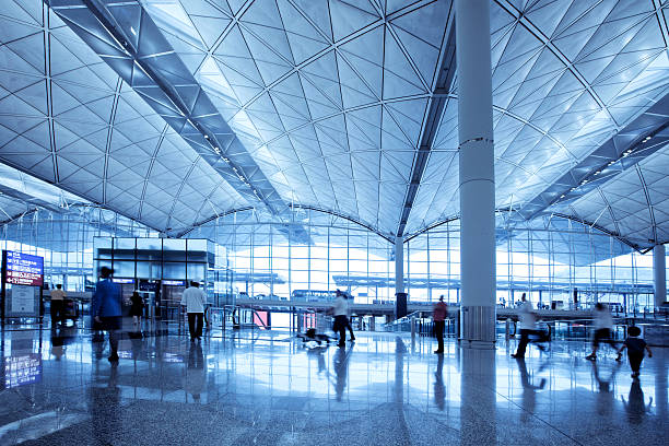 istock Travellers rushing through modern airport 182247835