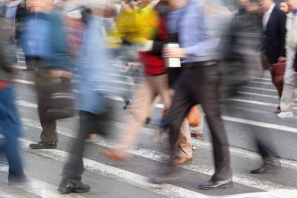 istock Busy people in a downtown crosswalk 182247961