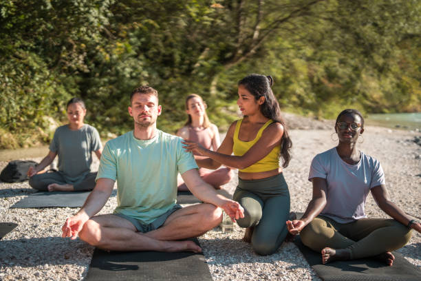 istock Diverse Group Yoga by the River with Indian Female Instructor 1822479723