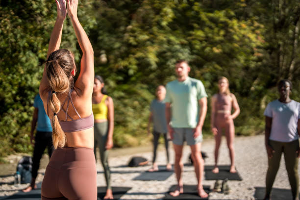 istock Riverside Yoga Bliss with Diverse People 1822480250