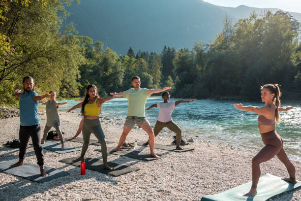 istock Sunlit Diverse Yoga Warriors 1822480263