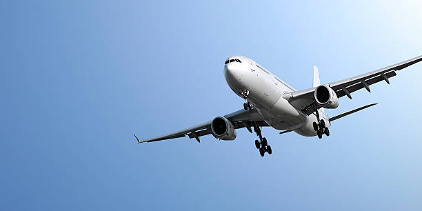 istock jet airplane landing in blue sky 182248061