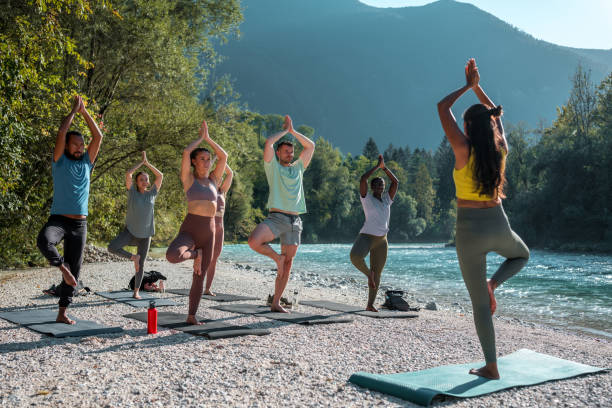 istock Multicultural Yoga Gathering by the Water 1822481412