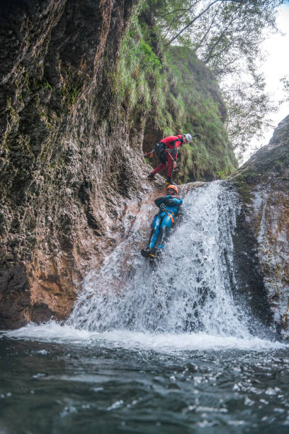 istock Black Male Enjoying the Slide Down Canyoning 1822483659