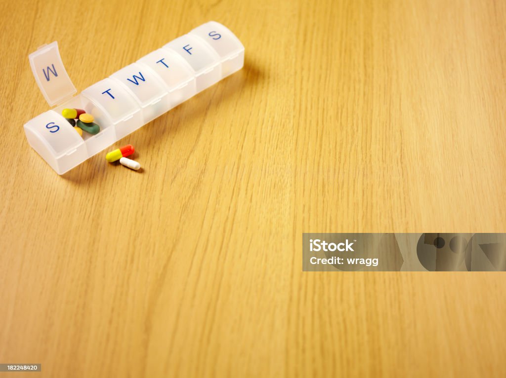 Colourful Tablets and Pill Box Colourful medical tablets in a daily pill box. Copy space.Click on the link below to see more of my medical images. Acetaminophen Stock Photo