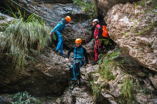 istock Caucasian Guide Leads Diverse Friends in Canyoning 1822485898