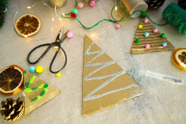 istock A creative handmade little Christmas tree of cardboard. eco-friendly and zero waste concept 1822488069