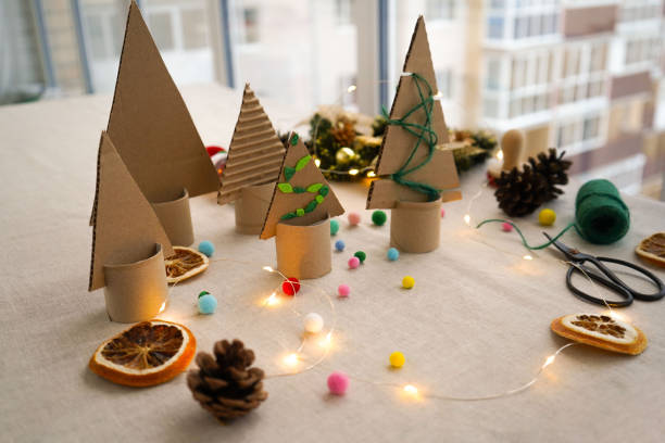 A creative handmade little Christmas tree of cardboard. eco-friendly and zero waste concept
