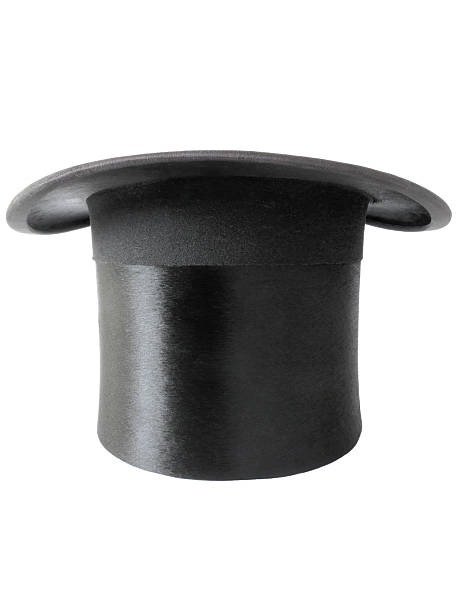 Magician's black top hat isolated on white. Antique black silk top hat in fantastic condition, isolated on white and waiting for a rabbit to be pulled from it. black hat upside down stock pictures, royalty-free photos & images