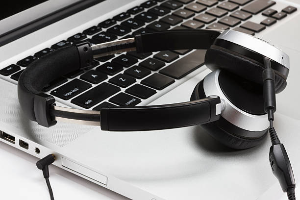 istock Laptop Keyboard and Headphones. 182249425
