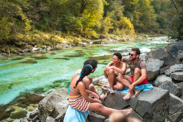 istock International Students Hanging Out By The River 1822494585