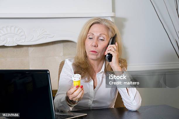 Woman Seeking Information About Prescrition Medicine Stock Photo - Download Image Now