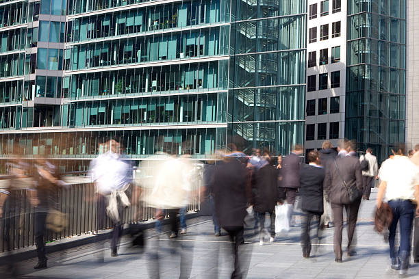 istock Business people walking in a financial district, blurred motion 182249590
