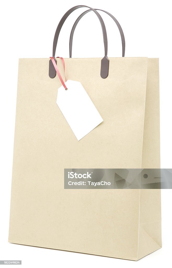 Braunes Papier-Einkaufstasche mit leeren Etikett Isoliert - Lizenzfrei Allgemein Stock-Foto