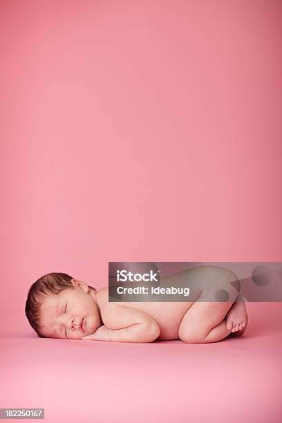 Newborn Baby Girl Sleeping Peacefully On Pink Background Stock Photo - Download Image Now